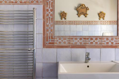 a bathroom with a sink and a mirror at Villa Rose Acireale Santa Tecla in Santa Tecla