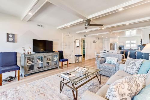 a living room with a couch and a table at High End Coastal Feel Condo in Fernandina Beach