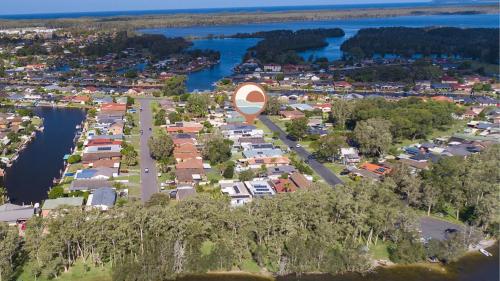 an aerial view of a town next to a body of water at Guest House On Guy in Forster