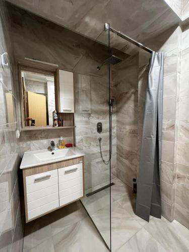 a bathroom with a shower and a sink at Apartman Paradise Fojnica in Fojnica