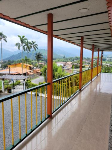 a balcony with a view of the water at CASONA HOTEL LA DIVISA in Santa Rosa de Cabal