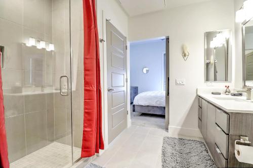 a bathroom with a shower and a glass door at Private Rooftop Terrance-Walk Score 81-Shopping District-King Bed-Parking 4003 in Scottsdale