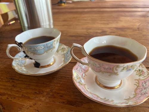 two cups of coffee on saucers on a table at kakayama hutte in Muraoka