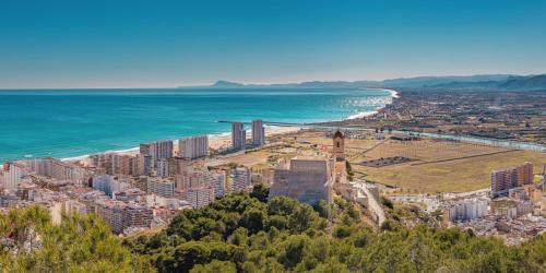 an aerial view of a city and the ocean at Beach Apartment in Cullera in Cullera