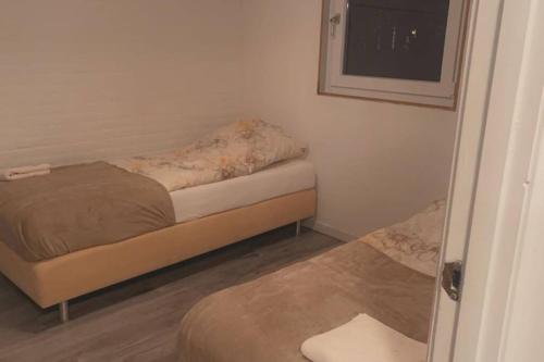 Tempat tidur dalam kamar di Leuke bungalow in Noord-Holland
