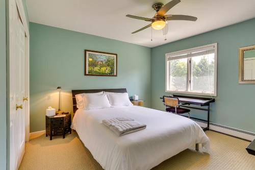 a bedroom with a bed and a ceiling fan at Warwick Vacation Rental with Private Yard and Fire Pit in Warwick