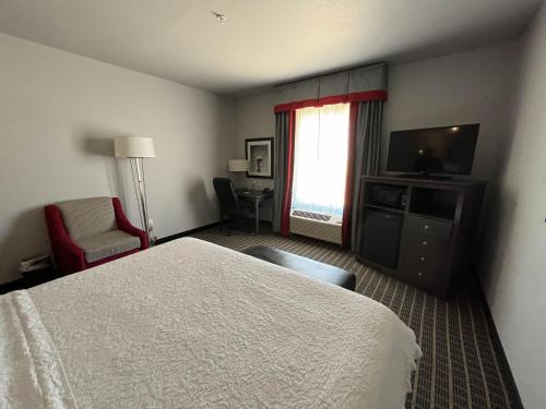 Ένα ή περισσότερα κρεβάτια σε δωμάτιο στο Quality Inn & Suites