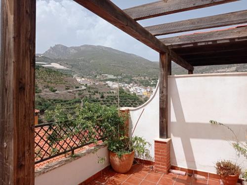 a balcony with a view of a mountain at El Picacho de Ítrabo Ático in Ítrabo