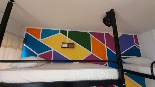 Una cama o camas en una habitación de Panamerican Hostel