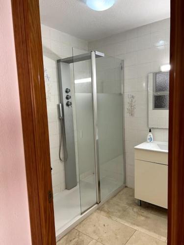 a bathroom with a shower and a sink at Detached Pool Villa, idyllic setting 450m to beach in Caleta De Velez