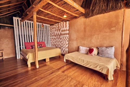 a bedroom with two beds in a room at Casa Love in Sayulita