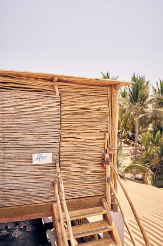 a large wooden wall with a sign on it at Casa Love in Sayulita