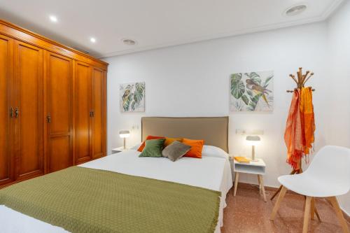 a bedroom with a large bed and a desk at Stars Courtyard by Fidalsa in Asprillas