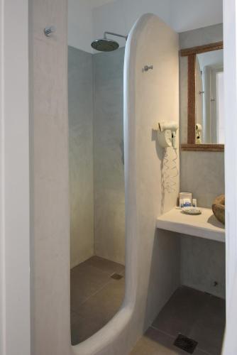 a bathroom with a shower and a sink at Tania Milos in Pollonia