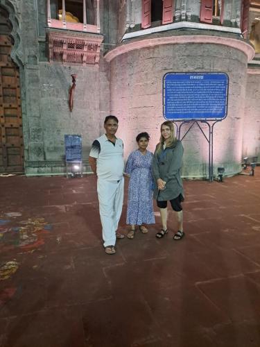 a group of people standing in front of a building at Narmada Guest House in Indore