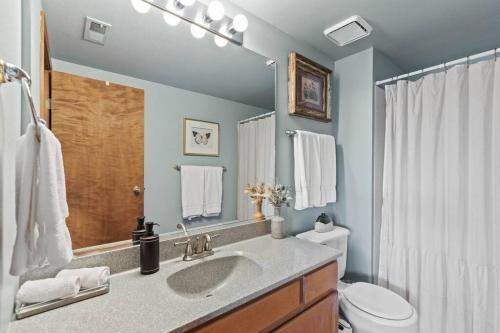 a bathroom with a sink and a toilet at Hot tub! Sleeps 8-11Upscale Area in Spokane