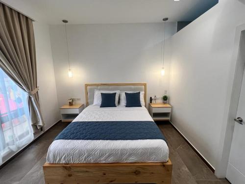 Posteľ alebo postele v izbe v ubytovaní Golden Garden hotel & suites