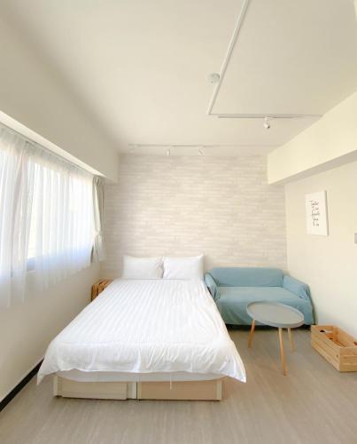 Una cama o camas en una habitación de 無印旅行