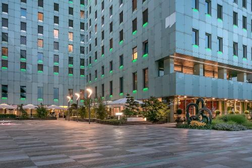 a large building with a plaza in front of it at Grand Hotel River Park, a Luxury Collection Hotel, Bratislava in Bratislava