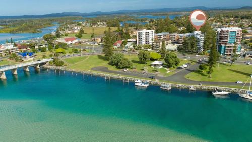 an aerial view of a city and a bridge over a river at Heritage unit 101 in Tuncurry