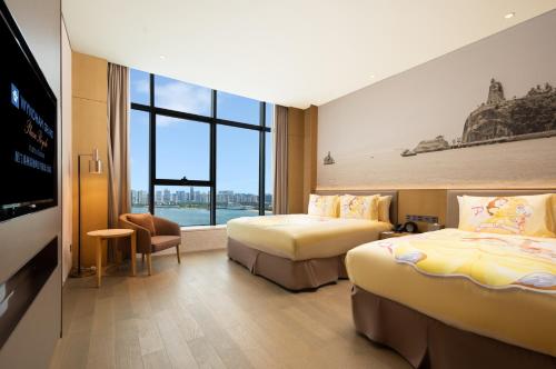Postel nebo postele na pokoji v ubytování Wyndham Grand Plaza Royale Yuzhou Xiamen Wuyuan Bay