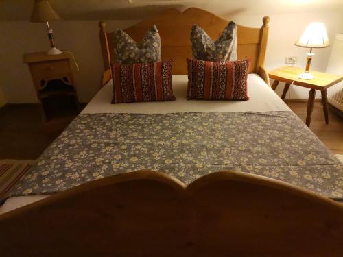 a bedroom with a bed with a book on it at Dridif 135 in Dridif