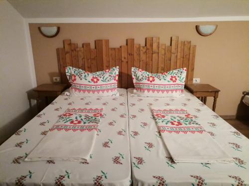 a bed with two pillows on top of it at Dridif 135 in Dridif