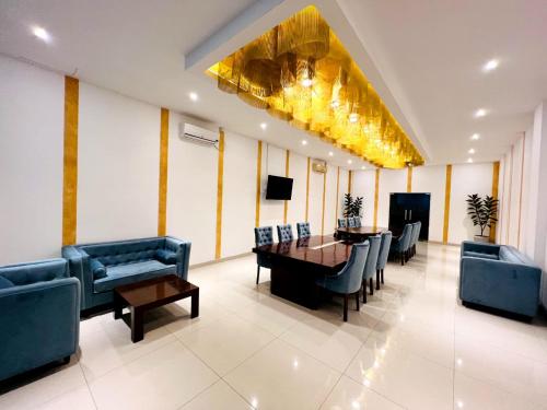 a lobby with a dining room with a table and chairs at The Epitome in Kurunegala