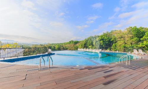 a swimming pool on a deck with a view at The Epitome in Kurunegala