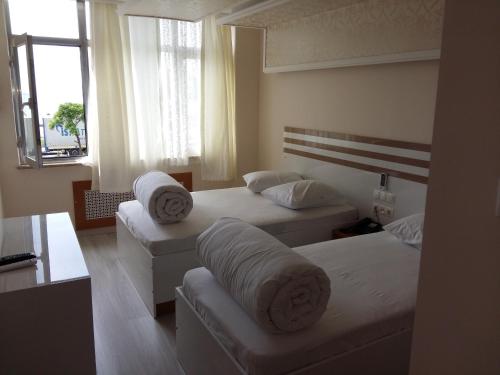 Voodi või voodid majutusasutuse Cihan Hotel toas