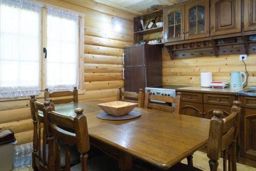 a wooden kitchen with a wooden table with a bowl on it at Holiday Home JASEN in Kolašin