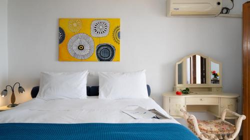 Ένα ή περισσότερα κρεβάτια σε δωμάτιο στο Loukia Apartments