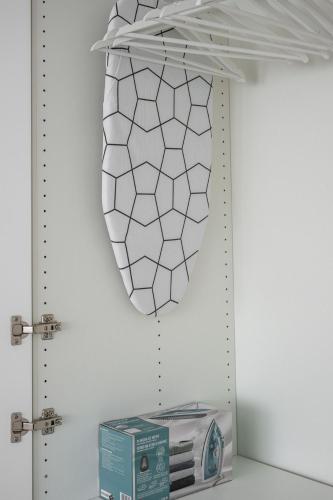 a mirror hanging on a wall next to a box at Apartamento Luis de Vargas in Huelva