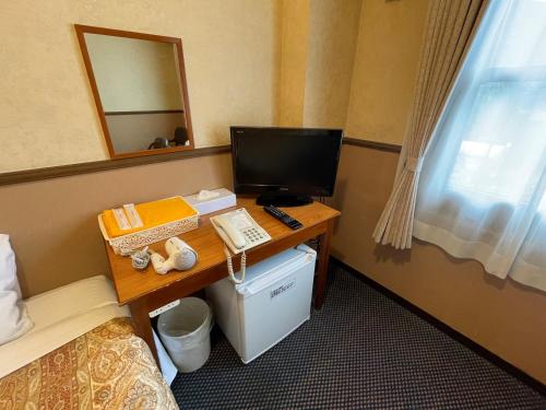 a hotel room with a desk with a computer on it at Gora Hotel Paipuno Kemuri Plus in Hakone