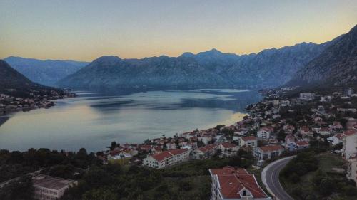 an aerial view of a town on a lake with mountains at Apartment Marta 2 in Kotor