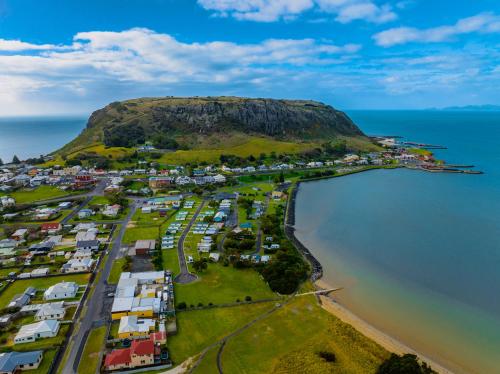 an aerial view of a small island in the water at BIG4 Tassie Getaway Park Stanley in Stanley