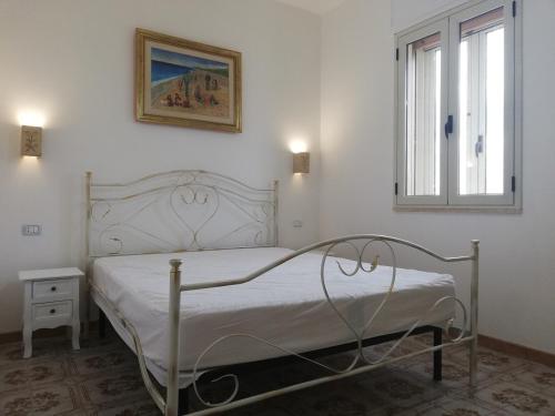 Postel nebo postele na pokoji v ubytování Residence Giglio