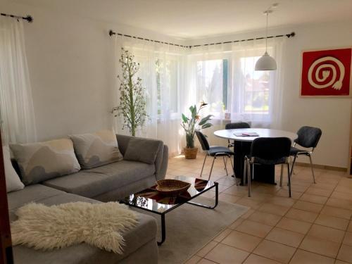 a living room with a couch and a table at HappyTime in Eriskirch