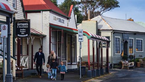 a group of people walking down a street at BIG4 Tassie Getaway Park Stanley in Stanley