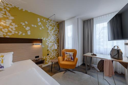 Ένα ή περισσότερα κρεβάτια σε δωμάτιο στο Mercure Hotel Stuttgart Gerlingen