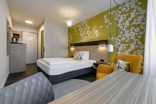 Ένα ή περισσότερα κρεβάτια σε δωμάτιο στο Mercure Hotel Stuttgart Gerlingen