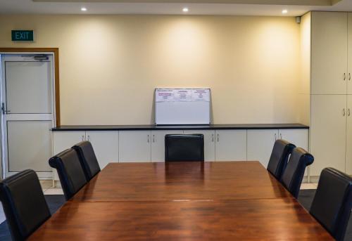 a conference room with a wooden table and chairs at BIG4 Tassie Getaway Park Stanley in Stanley
