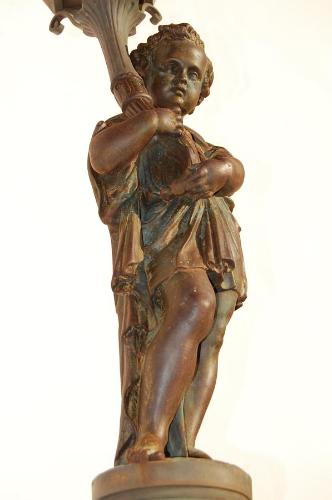 a bronze statue of a girl holding an umbrella at Fazenda Cachoeira Grande in Vassouras