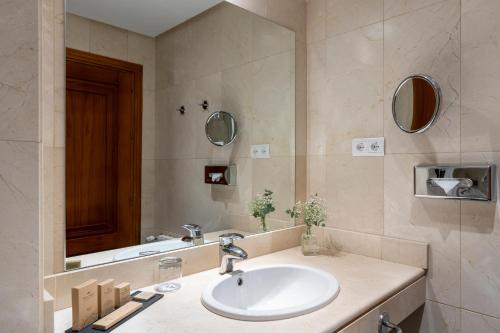 a bathroom with a sink and a mirror at Parador de Ronda in Ronda