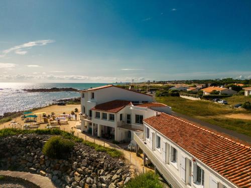 a white house with a view of the ocean at La Villa Saint Jean in Les Sables-dʼOlonne
