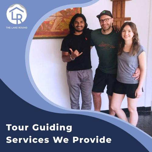 a group of three people posing for a picture at The Lake Round Guest House in Kandy