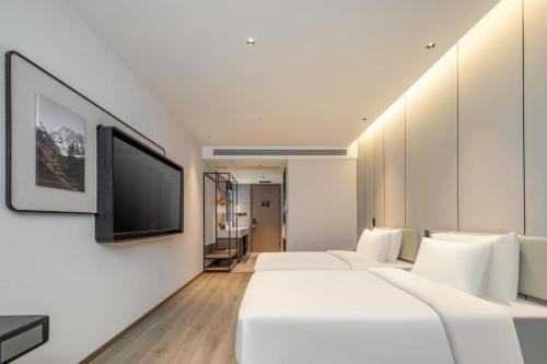 TV a/nebo společenská místnost v ubytování Atour Hotel Luqiao Taizhou
