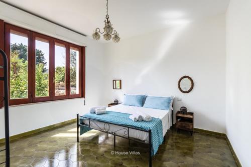 Postel nebo postele na pokoji v ubytování House&Villas - La Giara