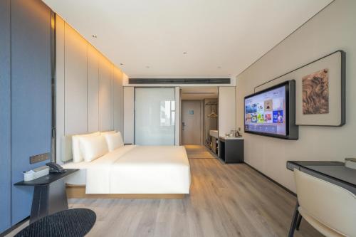 Μια τηλεόραση ή/και κέντρο ψυχαγωγίας στο Atour Hotel Nanchang Chaoyang Jiuzhou Tianhong