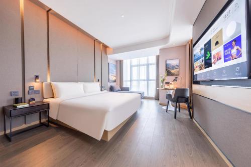 Atour Hotel Wuhan University of Technology Jiedaokouにあるベッド